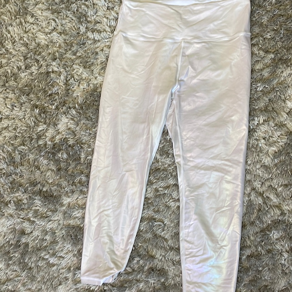 Unicorn white leggings with shimmer rainbow finish. Used no tears or stains.